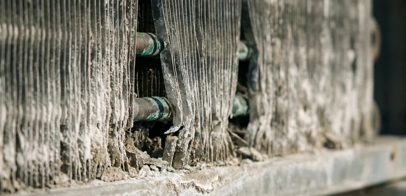 corroded aluminium fins on a coastal air conditioning condenser coil corroded aluminium fins on a coastal air conditioning condenser coil